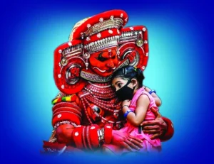 An image in which theyyam holds a child.Top offset printing services in kerala